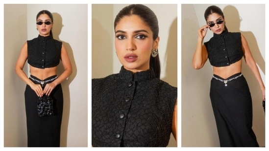 Bhumi Pednekar never fails to serve and slay her boss-lady looks. Draped in chic black overalls, she paired a buttoned-up crop top with a black skirt. With a waistchain complementing her skirt, she finished her look with cool shades and a high-glamour makeup look. This dress gave the vibe of a formal yet chic evening party wear. (Instagram/@bhumipednekar)