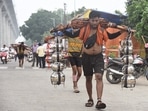 Kanwariyas carry holy water collected from Ganga River in Haridwar during Kanwar Yatra near Nandgram on Ghaziabad-Delhi-Meerut road. (Sakib Ali/HT)