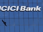 ICICI Bank share price: A bird flies past the facade of the ICICI bank head office in Mumbai.