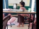 UP: Primary school teacher sleeping on the floor while students fan her in Aligarh. (X/@Gulzar_sahab) UP: Primary school teacher sleeping on the floor while students fan her in Aligarh. (X/@Gulzar_sahab)