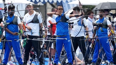 India's Dhiraj Bommadevara, left, Tarundeep Rai, center, and Pravin Ramesh Jadhav, right, compete during the men's archery (AP)