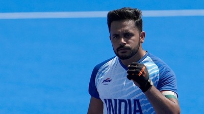 India's Harmanpreet Singh, center, celebrates after scoring a goal during the men's field hockey match between India and Argentina (AP)