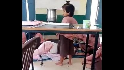 UP: Primary school teacher sleeping on the floor while students fan her in Aligarh. (X/@Gulzar_sahab) UP: Primary school teacher sleeping on the floor while students fan her in Aligarh. (X/@Gulzar_sahab)