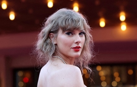 Taylor Swift is rarely seen without her red lipsticks look. (REUTERS)