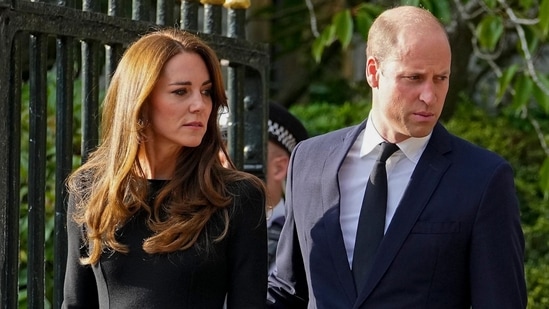 Britain's Prince William, second left, Kate, Princess of Wales, left, view the floral tributes for the late Queen Elizabeth II outside Windsor Castle, in Windsor, England on Sept. 10, 2022.(AP/Martin Meissner)