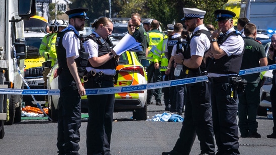 Police secure the area, where a man has been detained and a knife has been seized after a number of people were injured in a reported stabbing, in Southport, Merseyside, England, Monday July 29, 2024.(AP)