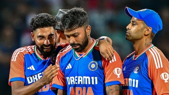 India's Hardik Pandya (C) celebrates with captain Suryakumar Yadav (R) and Mohammed Siraj after taking a wicket. (AFP)