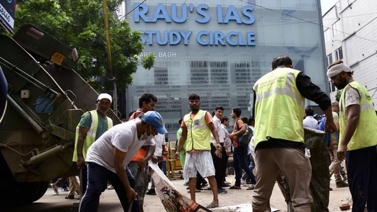 MCD workers outside the 'Rao IAS Study Centre' in Old Rajinder Nagar in New Delhi. (ANI?Photo)