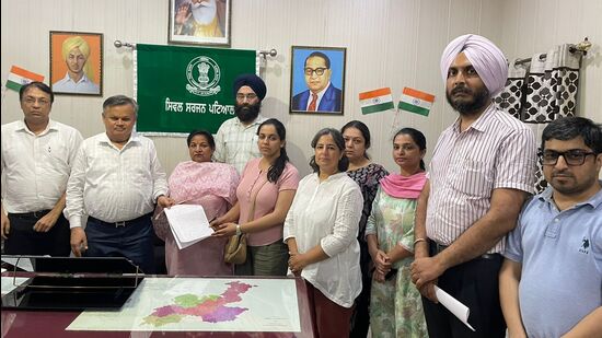 Members of the Punjab Civil Medical Services Association hand over their demand letter to Patiala civil surgeon Sanjay Goyal on Monday.