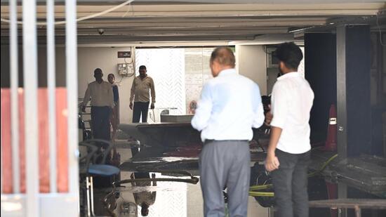 Officials probe the ground floor and the passageway to the basement of the Rau Study Circle building in Rajendra Nagar. (Arvind Yadav/HT Photo)