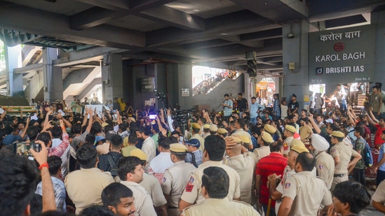 Students protest outside Karol Bagh metro station after 3 UPSC aspirants drown in the flooded basement of Rau's IAS institute at Old Rajinder Nagar area, in New Delhi, Sunday, July 28, 2024. (PTI)