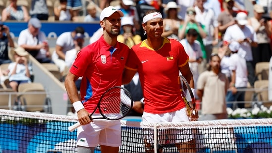 Rafael Nadal (R) of Spain and Novak Djokovic of Serbia pose for photos ahead of their Men's Singles second round match at the Tennis competitions in the Paris 2024 Olympic Games(EPA-EFE)