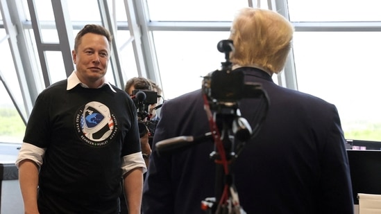 FILE PHOTO: U.S. President Donald Trump and Elon Musk are seen at the Firing Room Four after the launch of a SpaceX Falcon 9 rocket and Crew Dragon spacecraft on NASA's SpaceX Demo-2 mission to the International Space Station from NASA's Kennedy Space Center in Cape Canaveral, Florida, U.S. May 30, 2020. (REUTERS)