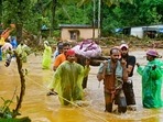 Relief personnel carry the body of a victim, during a search and rescue operation at a site following landslides in Wayanad on July 30, 2024. (Photo by R. J. Mathew / AFP) Relief personnel carry the body of a victim, during a search and rescue operation at a site following landslides in Wayanad on July 30, 2024. (Photo by R. J. Mathew / AFP)