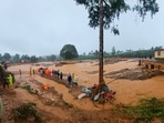 Rescuers and others inspect the spot after landslides hit hilly villages in Wayanad district, Kerala state, India. Rescuers and others inspect the spot after landslides hit hilly villages in Wayanad district, Kerala state, India.