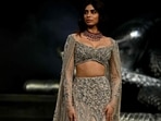 Actor Khushi Kapoor presents a creation by Indian fashion designer Gaurav Gupta during the FDCI India Couture Week.