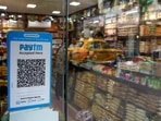A QR code sticker of the digital payment app Paytm is seen outside a grocery store in Kolkata, India.