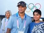 Former Indian men's cricket team coach Rahul Dravid with a young fan. Former Indian men's cricket team coach Rahul Dravid with a young fan.