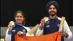 Bronze medalists Manu Bhaker and Sarabjot Singh pose during the medal ceremony for the 10m Air Pistol Mixed Team event, on Tuesday. (EPA-EFE) Bronze medalists Manu Bhaker and Sarabjot Singh pose during the medal ceremony for the 10m Air Pistol Mixed Team event, on Tuesday. (EPA-EFE)