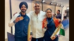 DAV College sports in-charge Amanendra Mann (centre) with Olympic bronze medallists Sarabjot Singh and Manu Bhaker. (HT Photo) DAV College sports in-charge Amanendra Mann (centre) with Olympic bronze medallists Sarabjot Singh and Manu Bhaker. (HT Photo)