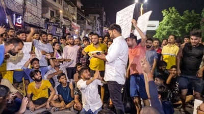 Students hold protest demanding justice for three UPSC aspirants who died inside a flooded basement of a coaching centre. (PTI) Students hold protest demanding justice for three UPSC aspirants who died inside a flooded basement of a coaching centre. (PTI)