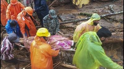 Rescuers in Wayanad district. (PTI) Rescuers in Wayanad district. (PTI)