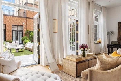 "Wide-plank rift oak floors and brilliant southern light through a wall of Palladian-style windows with multiple french doors opening onto an enchanted park-side terrace." (Brown Harris Stevens via StreetEasy) "Wide-plank rift oak floors and brilliant southern light through a wall of Palladian-style windows with multiple french doors opening onto an enchanted park-side terrace." (Brown Harris Stevens via StreetEasy)