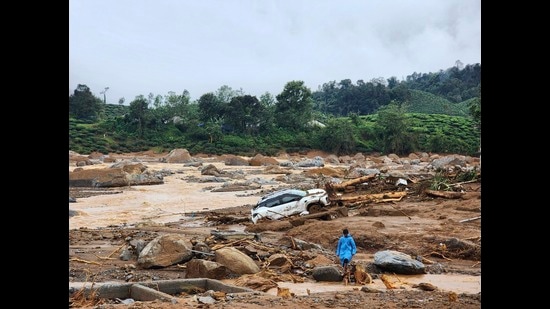 A damaged car lies amid debris after landslides hit hilly villages in Wayanad district, Kerala state, India, Tuesday, July 30, 2024. (AP Photo) (AP)