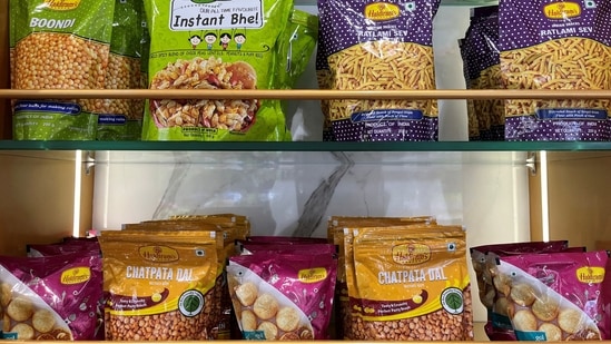 A view shows packets of snacks on the shelves inside a Haldiram's restaurant in Mumbai, India.(Reuters)