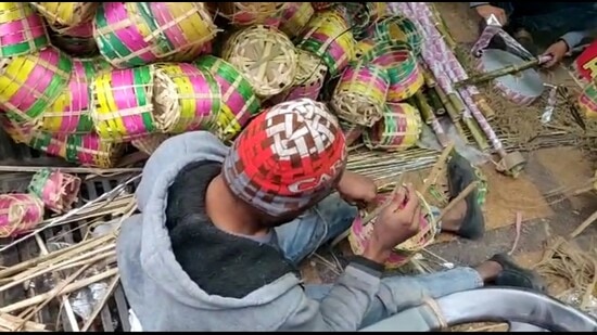 Mohd Saif showing baskets knitted for making kanwar. (Vishwas Dwivedi)