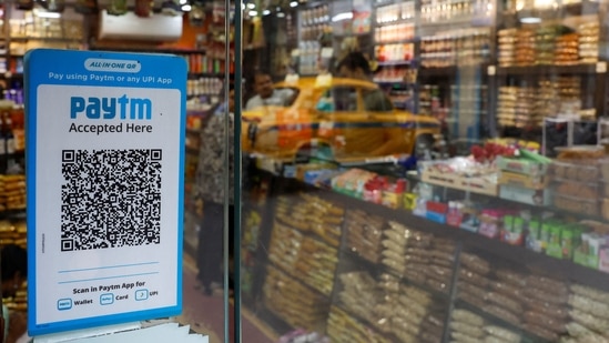 A QR code sticker of the digital payment app Paytm is seen outside a grocery store in Kolkata, India.(Reuters)