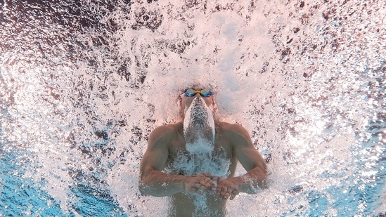 Tomoru Honda, of Japan, competes during a heat in the men's 200-meter butterfly at the 2024 Summer Olympics(AP)