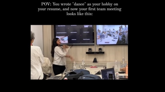 Snapshot of the woman dancing to in office meeting. 