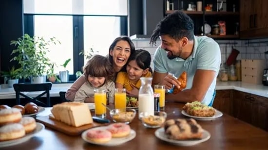 Having a slow morning with loved ones, having light conversations with them over breakfast and laughing out with them helps in feeling lighter and happier for the rest of the day.(Unsplash)