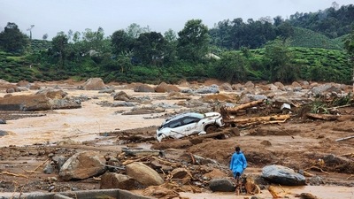 A damaged car lies amid the debris in Wayanad following landslides on Tuesday. (AP) A damaged car lies amid the debris in Wayanad following landslides on Tuesday. (AP)