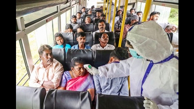 Coimbatore: Tamil Nadu Health workers check the temperature of passengers as a bus from Kerala enters the state amid the spread of Nipah virus, in Coimbatore district, Tuesday, July 23, 2024. (PTI07_23_2024_000158B) (PTI) Coimbatore: Tamil Nadu Health workers check the temperature of passengers as a bus from Kerala enters the state amid the spread of Nipah virus, in Coimbatore district, Tuesday, July 23, 2024. (PTI07_23_2024_000158B) (PTI)