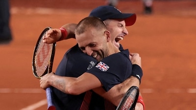 Andy Murray of Britain and Daniel Evans of Britain celebrate after winning their match against Sander Gille of Belgium and Joran Vliegen of Belgium. (REUTERS)