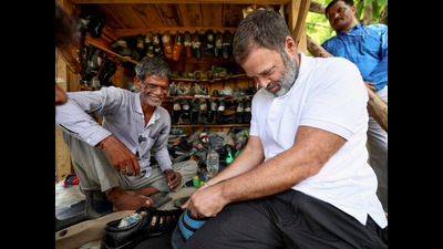 Rahul Gandhi with a cobbler during his visit to Sultanpur on July 26, 2024 (PTI File) Rahul Gandhi with a cobbler during his visit to Sultanpur on July 26, 2024 (PTI File)