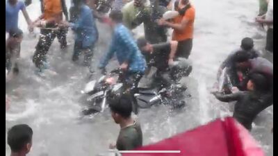 Rain revellers misbehaving with bikers in the city’s Gomti Nagar area. Rain revellers misbehaving with bikers in the city’s Gomti Nagar area.