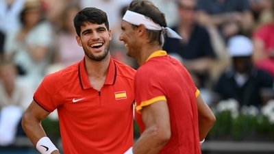 Spain's Carlos Alcaraz (L) playing with Spain's Rafael Nadal reacts while playing Netherlands' Tallon Griekspoor and Netherlands' Wesley Koolhof during their men's doubles second round tennis match (AFP) Spain's Carlos Alcaraz (L) playing with Spain's Rafael Nadal reacts while playing Netherlands' Tallon Griekspoor and Netherlands' Wesley Koolhof during their men's doubles second round tennis match (AFP)