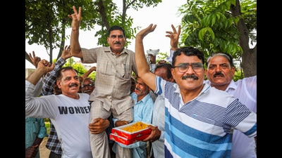 West Pakistani Refugees (WPRs) celebrate after the J&K administration granted proprietary rights to WPRs for land in the union territory, in Jammu on Wednesday. (PTI) West Pakistani Refugees (WPRs) celebrate after the J&K administration granted proprietary rights to WPRs for land in the union territory, in Jammu on Wednesday. (PTI)