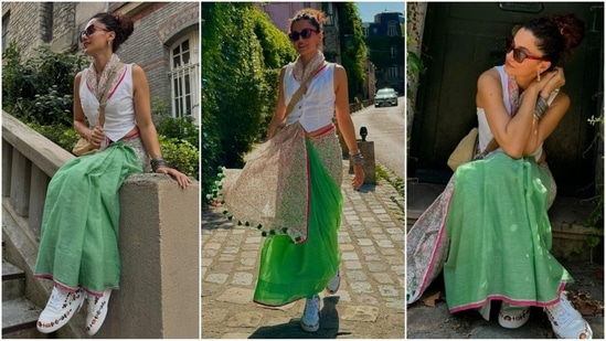 Taapsee Pannu wowed at the 2024 Paris Olympics with a modern saree look, swapping a blouse for a chic white waistcoat. (Instagram/@taapsee)