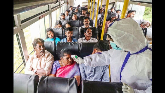 Coimbatore: Tamil Nadu Health workers check the temperature of passengers as a bus from Kerala enters the state amid the spread of Nipah virus, in Coimbatore district, Tuesday, July 23, 2024. (PTI07_23_2024_000158B) (PTI)