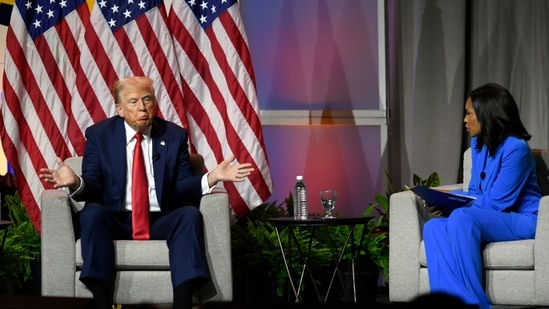 Republican presidential candidate Donald Trump left, participates in a discussion at the National Association of Black Journalists Convention and Career Fair in Chicago, Wednesday, July 31, 2024. On the right is ABC's Rachel Scott. (AP / Paul Beaty)