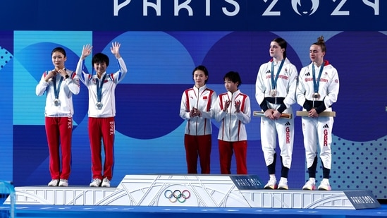 Gold medallists Hongchan Quan of China and Yuxi Chen of China stand near silver medallists Jin Mi Jo of North Korea and Mi Rae Kim of North Korea, and bronze medallists Lois Toulson of Britain and Andrea Spendolini Sirieix(REUTERS)