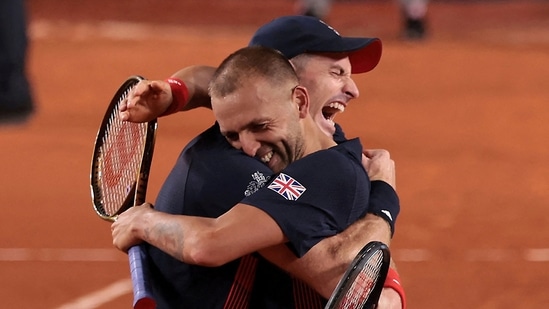 Andy Murray of Britain and Daniel Evans of Britain celebrate after winning their match against Sander Gille of Belgium and Joran Vliegen of Belgium.(REUTERS)