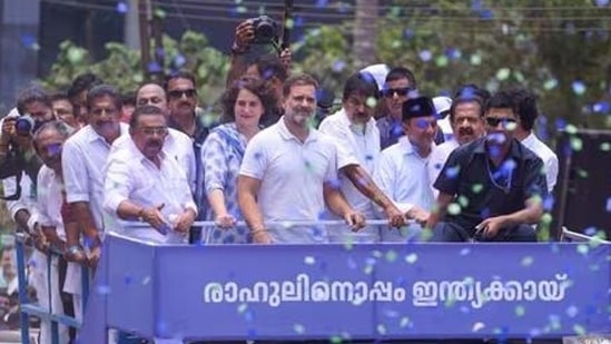 Priyanka Gandhi Vadra with Rahul Gandhi during the latter’s roadshow ahead of filing his nomination for the Lok Sabha polls in Kerala’s Wayanad in April 2024. (AP File Photo)