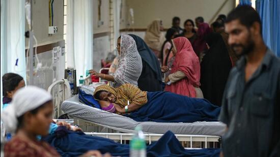 Survivors of the landslide receive medical treatment at a hospital in Wayanad. (AFP)