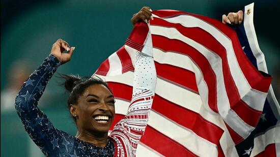 US' Simone Biles celebrates after team USA won the artistic gymnastics women's team final during the Olympic Games at the Bercy Arena in Paris. (AFP)