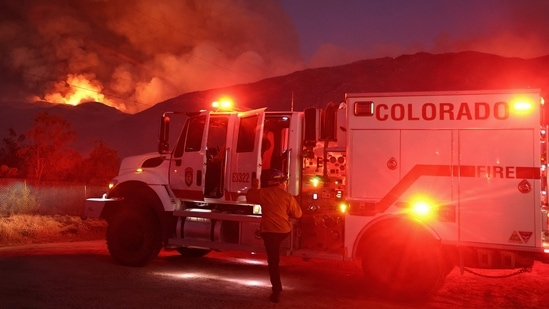 A firefighter works as the Nixon Fire burns with evacuation orders in the area on July 29, 2024 near Aguanga, California. The wildfire in Riverside County has scorched 3,700 acres thus far. 726,000 acres have burned in California so far this year- more than five times the average for this point in the summer. (Photo by MARIO TAMA / GETTY IMAGES NORTH AMERICA / Getty Images via AFP)(Getty Images via AFP)